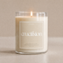 Candle with a label on a beige background