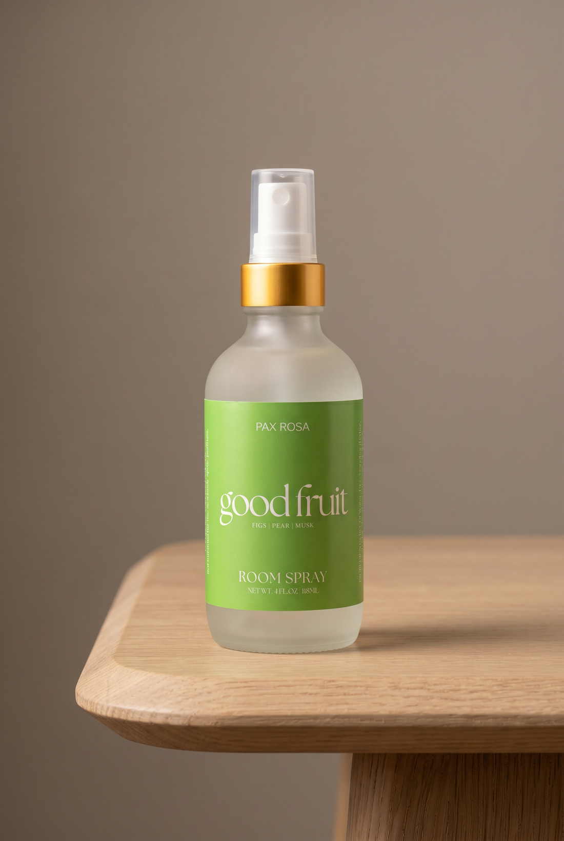 Room spray labeled as"good fruit" on a table