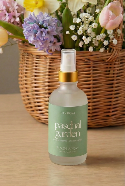 bottle with words written "paschal garden" on a wooden table.
