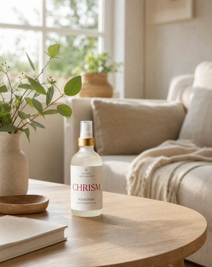 room spray bottle named chrism, on a table.