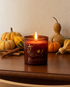 brown candle on table that says memento mori